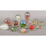 A collection of glass paperweights & dumps. (12)