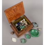 A box of gemstones and semi precious stones. Including worked malachite (10cm long), pyrite, etc.