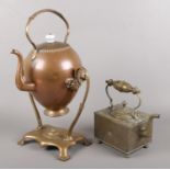 A copper spirit kettle along with a brass kettle stamped VR.