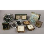 A box of mixed clocks. Includes two Smiths car clocks, Swiza, Westclox etc.