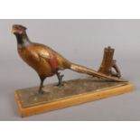 A mid 20th century cold painted spelter table lighter formed as a pheasant. Damage to end of tail.
