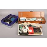 A box of assorted fishing equipment. To include floats, weights, and vintage fishing reels etc.