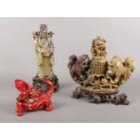 A collection of oriental style soapstone figures.