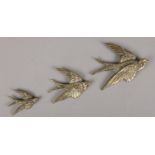 A set of three Victorian small graduated brass swallow wall plaques. Largest (10cm x 13cm)