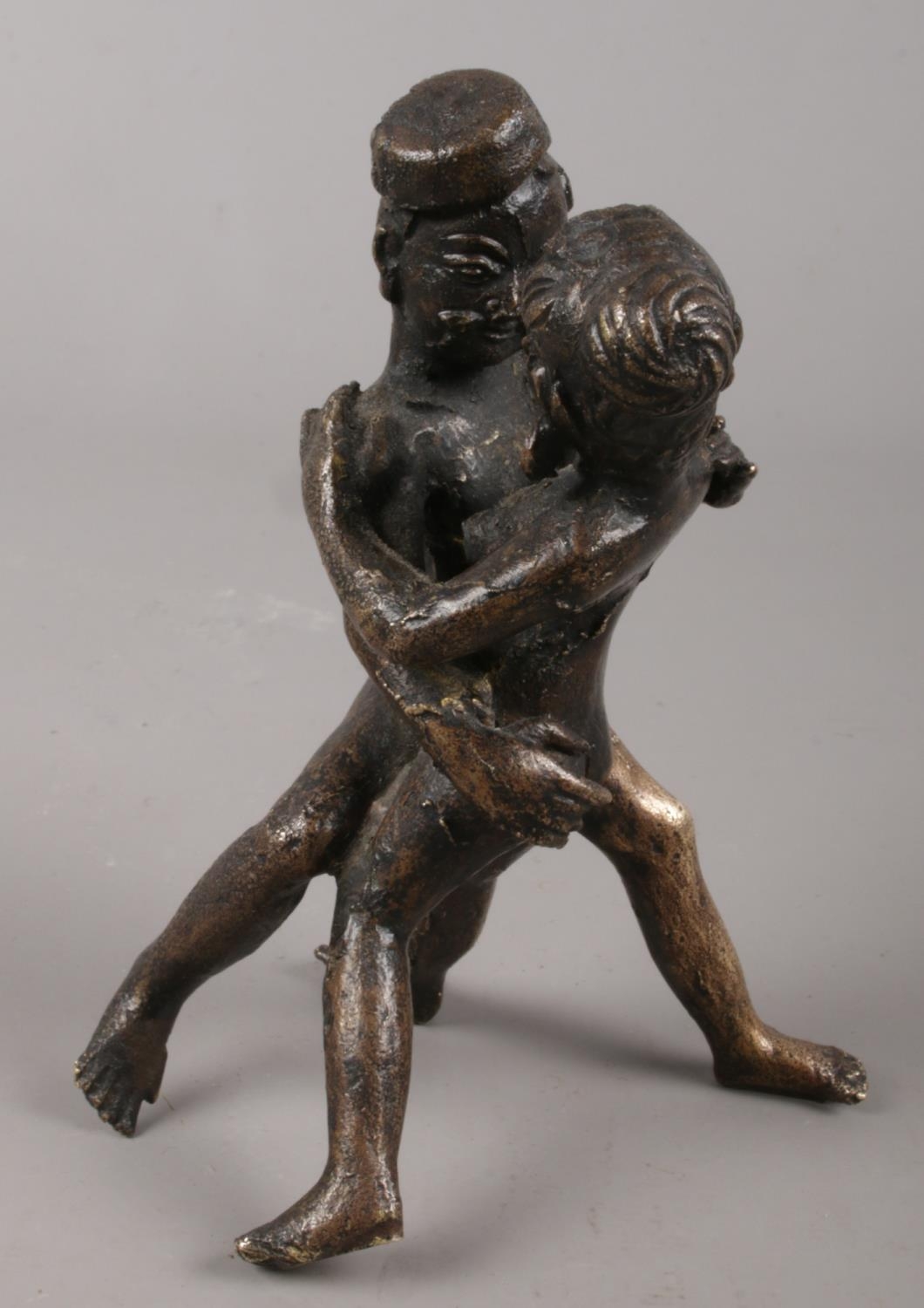 An Eastern cast bronze erotic figure group. 11cm.