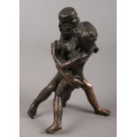 An Eastern cast bronze erotic figure group. 11cm.