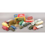 A box of die-cast vehicles. To include two boxed Dinky examples, along with several Matchbox and