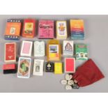 A quantity of playing cards. Including Tarots fortune telling cards, etc.