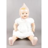 A large vintage doll. Soft bodied, moulded hair, sleeping blue eyes, Made in Canada.