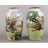 A pair of Chinese vases decorated with warriors on horse back. one of the vases cracked.