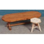 A low hardwood coffee table/bench, together with hexagonal 'alphabet' tripod stool.