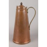 An arts and crafts Bensons Copper and Brass Water Jug. 25cm high.