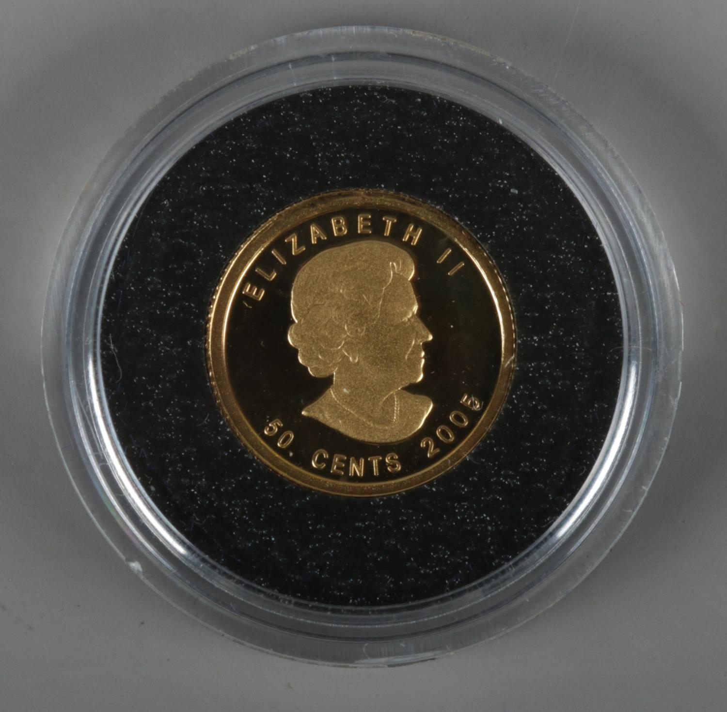 A Canadian 50 cents 2005 gold coin. Stamped fine gold 1/25 oz or pur.