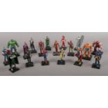 A quantity of painted lead Marvel character figures on black raised stands. Includes Spiderman,