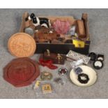 A box of collectables. To include two Ammeters with war dept arrows, three AA badges, bone and