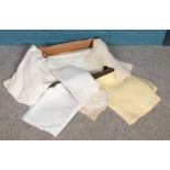 A collection of vintage linens. Three large tablecloths, Round & Oblong lace mats, lemon napkins,