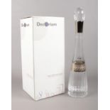 A slender Decorium glass decanter. Comprising of ribbed glass and Platinum decoration. H: 36.5cm. No