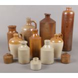 A collection of stone ink and whisky jars. Embossed examples include John McLennan, Edinburgh and