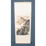 A large silk mounted Chinese watercolour scroll painting of a landscape. Chinese markings to the top