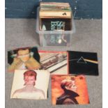 A box of LP records. Including Pink Floyd Dark Side of the Moon, Beatles, David Bowie, Adam and