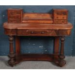 A Victorian carved rosewood and walnut duchess dressing table base. With bank of 3 drawers to each