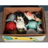 A box of novelty teapots. Including Penguin, Dinosaur, etc.