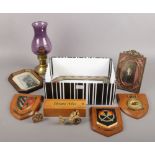 A box of collectables. Including small copper border mirror, shield wall plaques, ornate brass photo