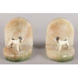 A pair of Alabaster and cold painted metal bookends set with terriers.