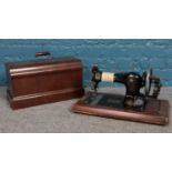 An Early 20th Century 'Federation' family hand sewing machine. Serial No. 483907, in original case.