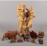 A quantity of wooden figures. Including large figure group of dragons, elephant, rhino, etc.