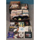 Three boxes of 45 RPM rock and pop records, including ABC, Stevie Wonder, Michael Jackson and