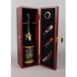 A wooden presentation box with a bottle of Manera Prosecco with drinking accessories - corkscrew and