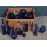 A box of blue glassware. Including vases, bottles, decanter, etc.