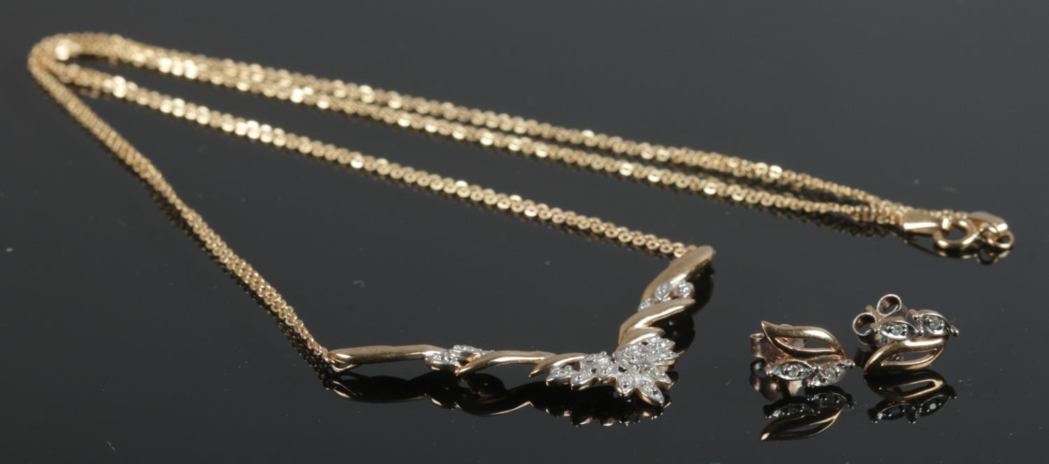 A 9ct Gold and Diamond necklace with matching earrings. Total weight: 4.68g