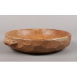 A Robert 'Mouseman' Thompson oak nut dish. with carved mouse, 15 cm diameter. water marks to