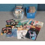 A box of rock & pop LP records and a box of Elvis books and memorabilia. The Shadows, Buddy Holly,