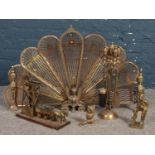 A collection of Brass fire objects. To include expanding fan fire screen and companion set.