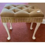 A small dressing table stool