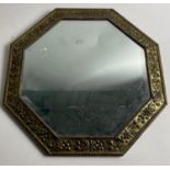 OCTAGONAL flower embossed metal framed bevelled mirror 43cm diam