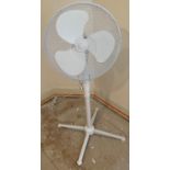 A floor standing electric fan which extends