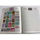 A STANLEY GIBBONS 'FOR THE STAMPS OF THE WORLD' stamp album full of some nice World stamps, some