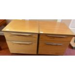 A pair of bedside cabinets with drawers top dimensions 46cm x 48cm