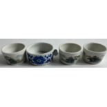 A set of three small porcelain drinking cups with tiny twin handles with hand painted traditional