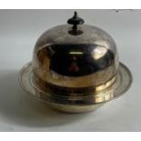 A silver plate muffin dish with domed cover and ebonised handle