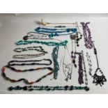 A mixed selection of mainly beaded necklaces, some still with labels on.