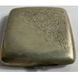 A VINTAGE EPNS cigarette case with hand engraved lid 9cm square