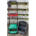An electric lawn rake by QUALCAST with grass collecting box