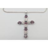 925 stamped cross pendant set with 5 red stones (probably garnets) on a 44cm 925 stamp fine chain