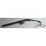 An ANTIQUE GRUESOME wooden item described as a 'slave whip' approx 28cm long