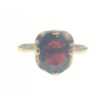 A nice 375 stamped yellow gold ring size M with large OVAL GARNET set stone(1cm length) weight